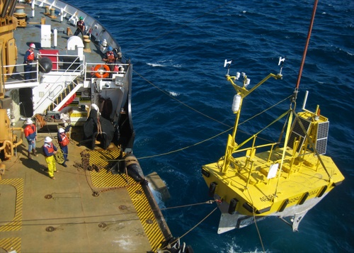 The crew of the 225-foot Coast Guard Cutter Maple redeploys a NOAA weather data buoy 29 miles southwest of Cape Edgecumbe, near Sitka, Aug. 20. The cutter crew originally recovered the buoy in September 2012 when it became adrift in the Gulf of Alaska. (U.S. Coast Guard photo by cutter Maple)
