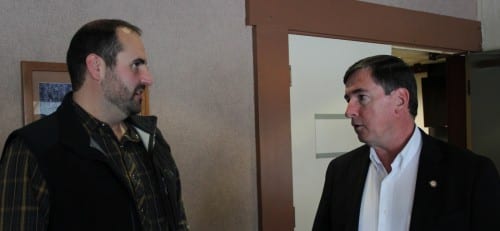 Republican Steven Samuelson (right) speaks with Anchorage Mayor Dan Sullivan. (KCAW photo/Rachel Waldholz)