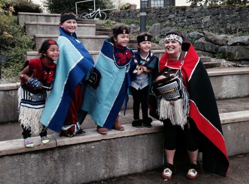 Heather Powell poses with some young dancers after the Naa Kahídi Dancers' 20th anniversary performance (Anne Brice/KCAW photo)