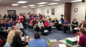 The hospital classroom fills for the board's noon meeting. Staffers urged transparency as the board moves forward. "A lot of what's happened has been a mystery to us," said one. (KCAW photo/Robert Woolsey)