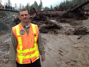 City engineer David Longtin is back working at the landslide that nearly overtook him Tuesday. Longtin is not totally at ease -- "I'm keeping my eye on it," he says. (KCAW photo/Robert Woolsey)