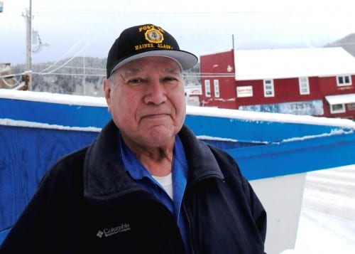 Ralph Strong, a 78-year-old Alaska Native veteran from Klukwan, poses outside the American Legion Hall in nearby Haines. (Photo by Jillian Rogers/KHNS)