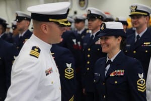 Incoming Air Station Sitka Commander William Lewin greets Yeoman Chief Petty Officer Clara Whitehead during his first formal review of the unit. (KCAW photo/Robert Woolsey)