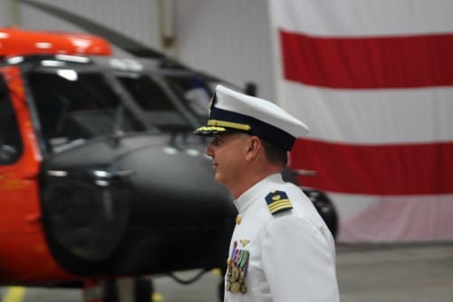 Relieved Air Station Commander Mark Vislay walks past one of the helicopters he's flown during his two years in Sitka. Vislay is being reassigned as a staff officer of the Coast Guard Commandant. (KCAW photo/Robert Woolsey)