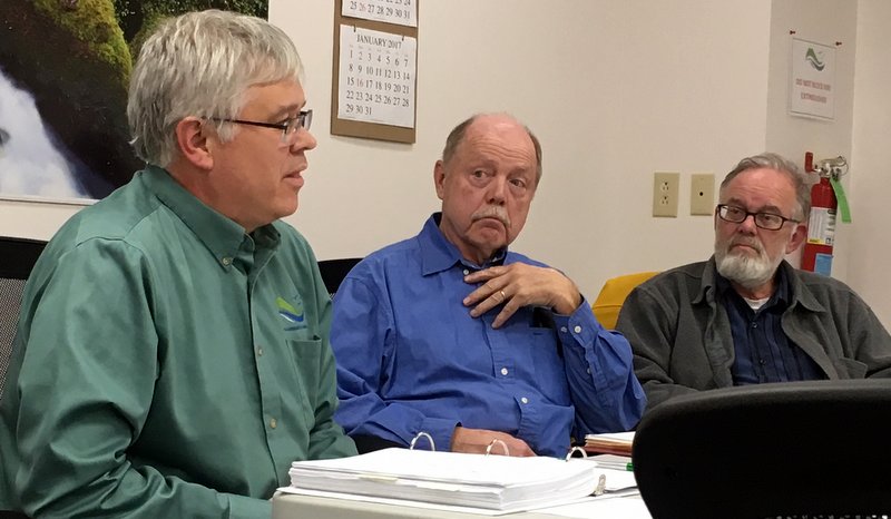 Sitka Community Hospital CEO Rob Allen (l.) explains the pros and cons of a "proposed affiliation" with SEARHC, as board members Steve Gage and David Lam look on. "We will survive," Allen said, even if the board decided not to move forward with the plan. (KCAW photo/Robert Woolsey)