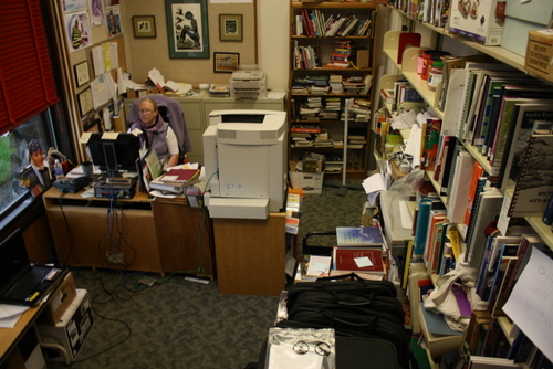 Library Director Sarah Bell works in her crowded office at Kettleson Memorial Library, in this September 2012 file photo. Her office has become defacto storage for a lot of equipment, something an upcoming expansion of the library aims to correct.