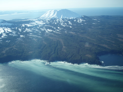 This photo shot Thursday (4-4-13) shows herring spawn in Shelikof Bay, on Kruzof Island. Mt. Edgecumbe looms behind. (Photo by ADF&G)