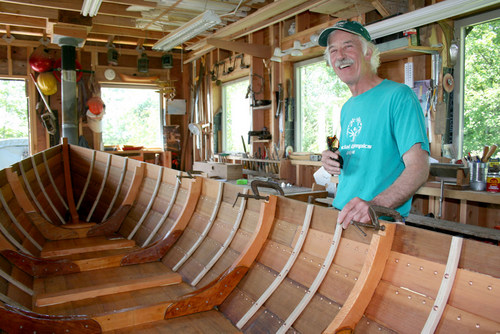 Mark Howey at work on his Lowell dory skiff. (KCAW photo / Erik Neumann)