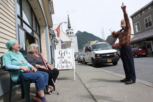 Jude Reis and Pamela Ash (left) talk with Stan Schoening outside the Baranof Island Artists' Cooperative on Wednesday afternoon. A plan to close this stretch of Lincoln Street to vehicles was canceled by the Sitka Assembly at its regular meeting on Tuesday. (KCAW photo by Ed Ronco)