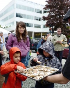 A family samples offerings at 2012's OysterFest. The shellfish came from a Haa Aani-supported oyster farm.