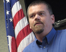 Mike Satre speaks to the Sitka Chamber of Commerce. (KCAW photo/Robert Woolsey)