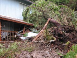 Heavy rainfall caused a landslide that moved this Cascade Creek home off its foundation. (KCAW photo/Emily Forman)