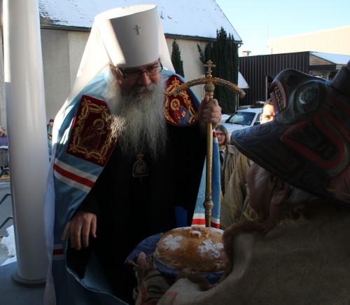 Herman Davis presents Metropolitan Tikhon with bread and salt. (KCAW photo/by Emily Forman)  