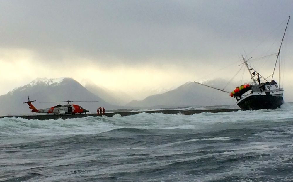 Two rescued as troller goes aground in heavy surf