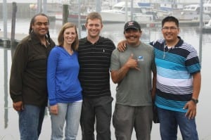Leone and his wife, Ellen Leone, pose with his rescuers at the La Push Marina. From left, Darryl Penn, Ellen Leone, Lance Leone, Charlie Sampson and Levi Black. (Photo: Ed Ronco/KPLU)