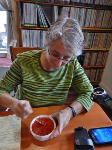 CoastAlaska executive director Mollie Kabler samples locally-produced ikura. The consensus of the taste test? "Fishy blueberries." (KCAW photo/Amy Kramer-Johnson)