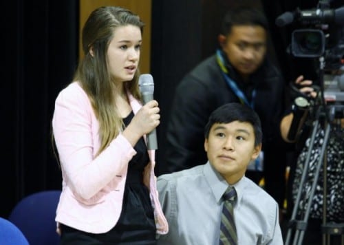 Katherine Dolma answers a question following a Supreme Court LIVE hearing at Barrow High School. Dolma and Nelson Kanuk, seated, are two of the six young plaintiffs in the case. (Photo by Jeff Seifert/ KBRW)