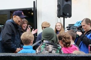 Gil Truitt (left) cuts the ribbon on the newly renovated Sage Building, while Research Director Tori O'Connell applauds. (KCAW photo/Rachel Waldholz).