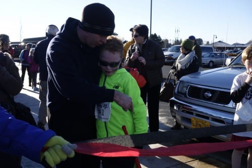 Shaun McGraw with his father, Nick Mcgraw, who ran alongside him. (Emily Kwong/KCAW). 