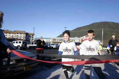 Shawn Sullivan finished first, but like several of the boys, came back to help Russell Burden across the finish line. (Emily Kwong/KCAW photo). 