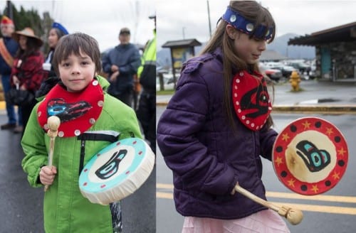 Sunny (l) and Rainy (r) McClenahan beat drums to herald the beginning of Heritage Month (Mike Hicks/KCAW photo)