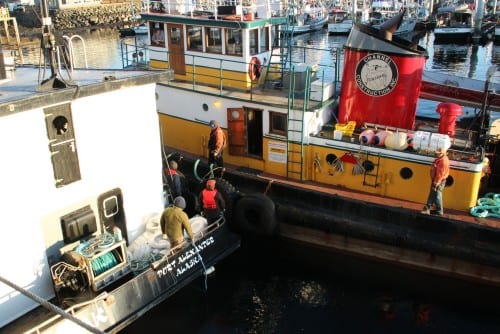 The Eyak bids goodbye to the tugboat Marauder, which brought it into Sitka Channel. (KCAW photo/Rachel Waldholz)