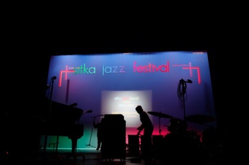 Stage crews worked diligently during the evening performances to change sets for over a dozen guest musicians. (Emily Kwong/KCAW photo)