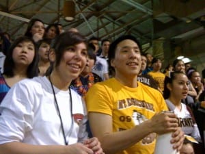 Mt. Edgecumbe students Candace Schaak and Jerry Active cheer for the Braves during the Region V Basketball tournament in 2010. (KCAW photo/Ed Ronco)