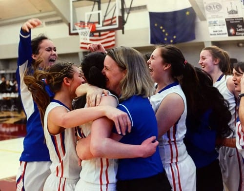 The Lady Wolves celebrate their regional win in Ketchikan, before heading to state in Anchorage. (Ingfrid Olney-Miller photo)