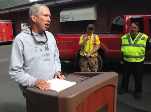 National Weather Service Meteorologist Joel Curtis (left) speaking with reporters in the aftermath of the 2015 slide, along with DOT geologist Mitch McDonald and Deputy Fire Chief Al Stevens (right). Curtis served as the incident meteorologist for the recovery effort. He describes it as one of the "major events" of his three-decade career.  (Robert Woolsey, KCAW)