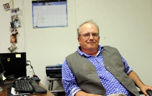 John Straley, in his office at the Sitka Public Defender. With up to 50 cases in play at any given time, Straley says the work "can be rewarding, but also heartbreaking." (KCAW photo/Robert Woolsey)