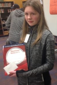 Romy Bekeris with her trophy, a Merriam-Webster dictionary. KCAW photo/Robert Woolsey.