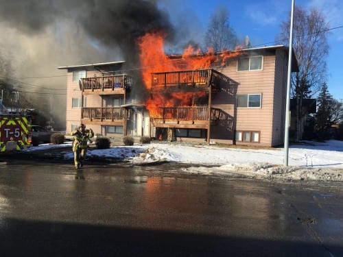 Sitka basketball players helped 11 occupants of this Anchorage six-plex escape the blaze. (Andy Lee photo)