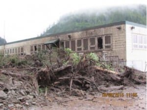 A debris flow along Sawmill Creek Road damaged GPIP's administrative building. (Photo from GeoTask Force report)