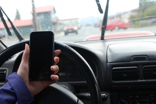 Tuesday night (4-26-16), the Sitka Assembly passed a law that would fine those using their phone while driving. Exceptions are made for hands-free use. (Photo courtesy of Her Campus Media)