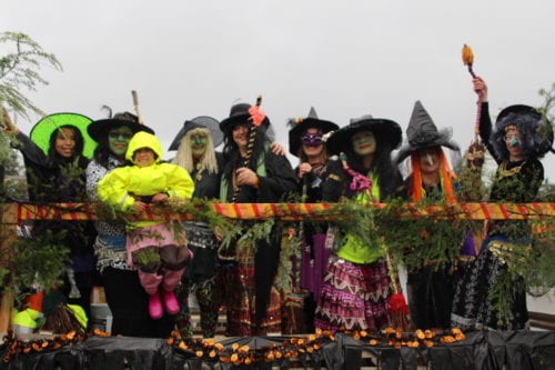 Witch belly dancers on their homemade float at the 2016 Alaska Day parade. (KCAW Photo/Emily Russell)