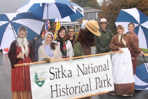 Employees from Sitka National Historical Park lining up to march in the 2016 Alaska Day parade. (KCAW Photo/Emily Russell)