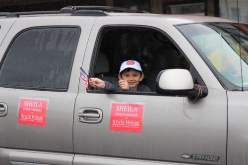 A young supporter of Sheila Finkenbinder at the 2016 Alaska Day parade. (KCAW Photo/Emily Russell)