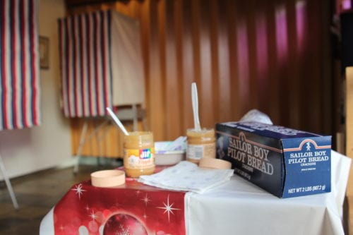 Tribal citizens snacked on pilot bread and maple flavored peanut butter while they cast their votes for Tribal Chairman and four open Tribal Council seats.(Emily Russell/KCAW Photo)
