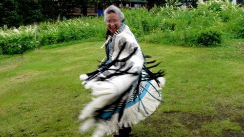 In a career spanning three decades, Teri Rofkar mastered the fiber arts of basketry and textile weaving. She is pictured here dancing in her daughter's Ravenstail Lituya Bay robe. Lituya Bay is the farthest back she can trace her family's history. (From Rofkar's Facebook page)
