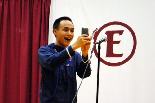Yup'ik singer and drummer Byron Nichoali takes a Snapchat of the Mt. Edgecumbe crowd. (Emily Russell/KCAW)