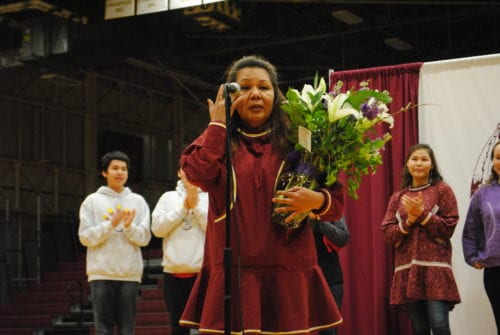 Rachel Moreno receives flowers from students at Founders Week celebration. (Emily Russell/KCAW)