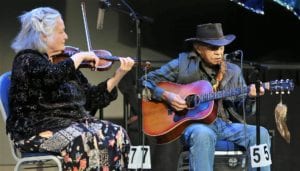 Yukon country singer Art Johns, 84, backed up by Skagway fiddler Nola Lamken, performs April 4, 2017, at the Alaska Folk Festival in Juneau. (Photo by Brian Wallace Photography)