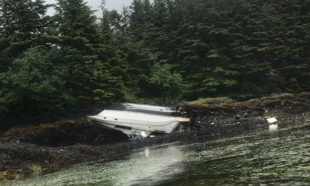 Overturned cabin cruiser stuck in Redoubt Bay