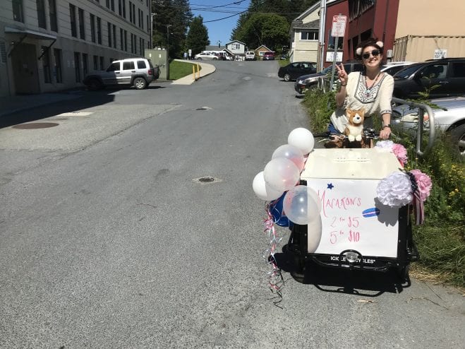 Grace Ivers gets ready to sell her macarons.