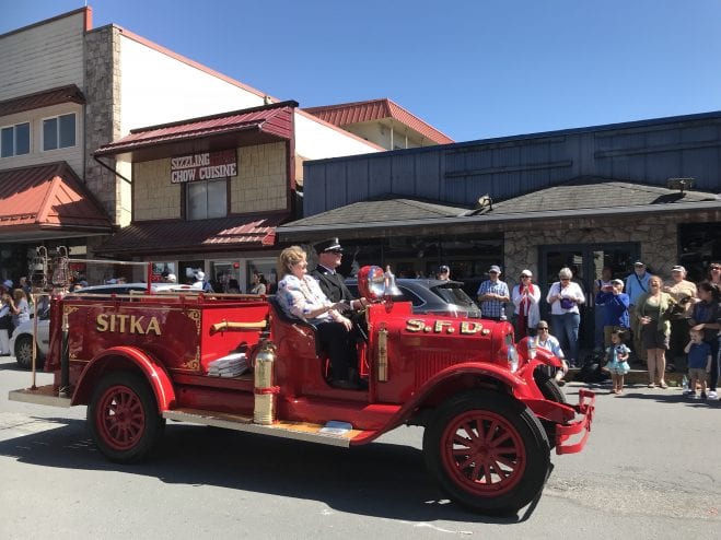 The SFFD in an antique vehicle. 