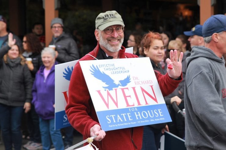 Republican challenger Richard Wein, pictured above on the campaign trail in the Alaska Day Parade in Sitka, ran against incumbent Democrat Jonathan Kreiss-Tomkins. (Photo by Enrique Pérez de la Rosa)