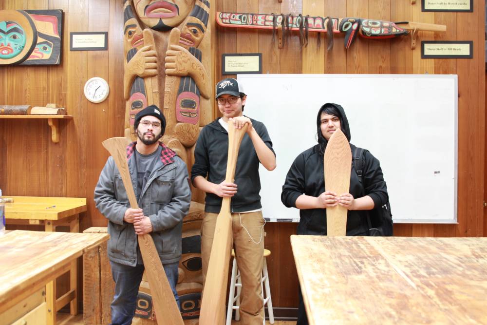 Students from Pacific High School travel to Sitka National Historical Park's visitor center every Friday to learn traditional carving techniques from artist Mark Sixbey. From left to right, senior David Abril, sophomore David Bean and sophomore Eric Alvarado pose with the paddles they have carved.