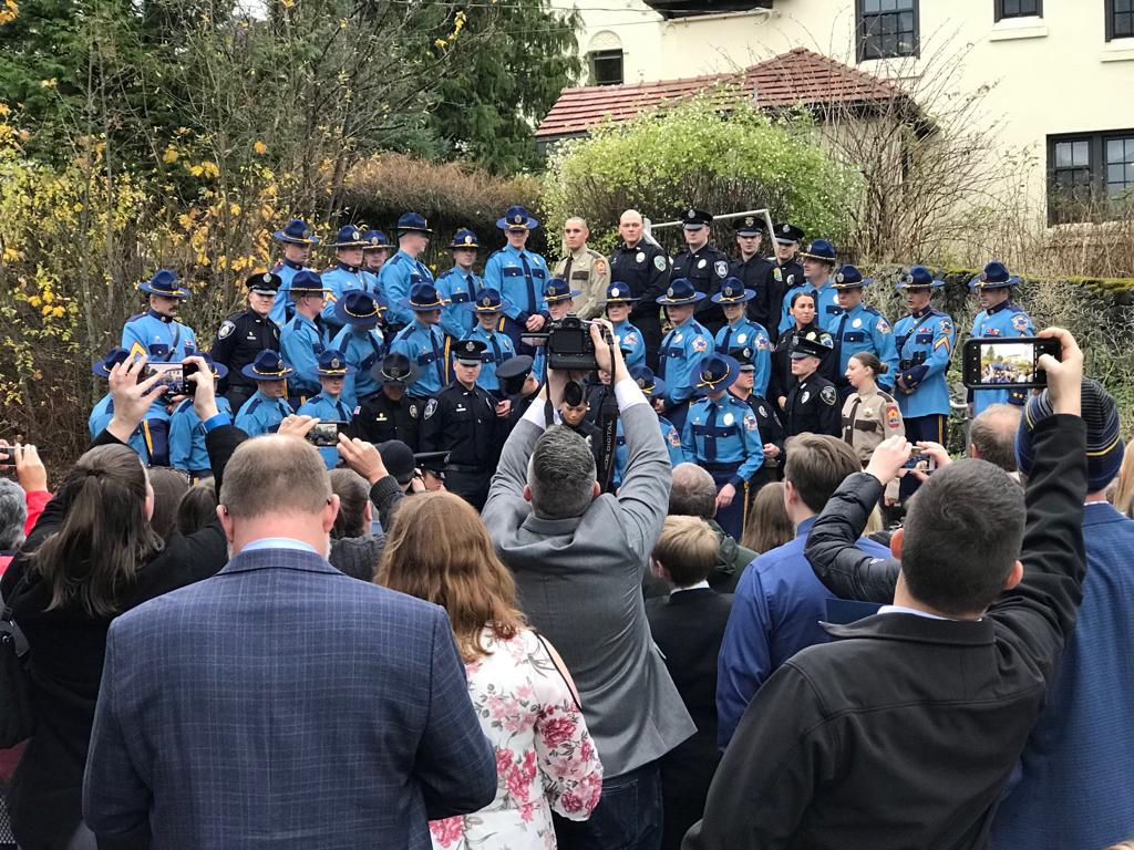 Graduates of the Public Safety Training Academy pose for photos for their friends and family. (Photo by Enrique Pérez de la Rosa)