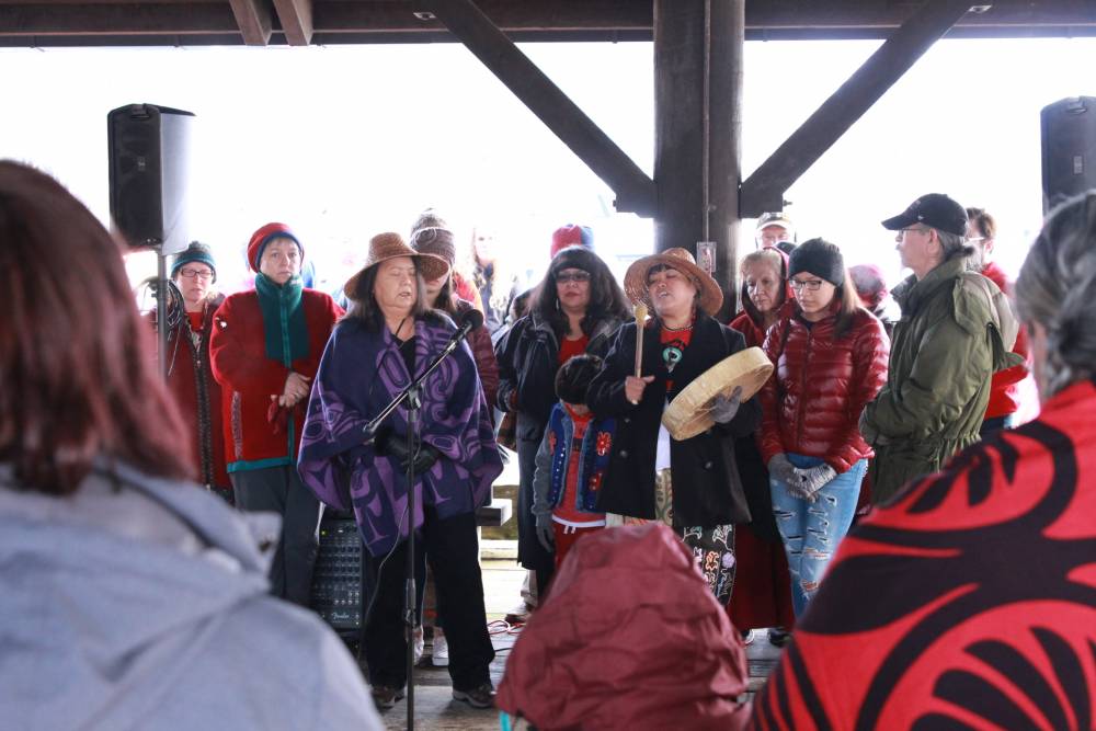 Louise Brady, Dion Brady Howard and other Tlingit Sitkans sang a mourning song for murdered and missing indigenous women. (KCAW photo/Enrique Pérez de la Rosa)